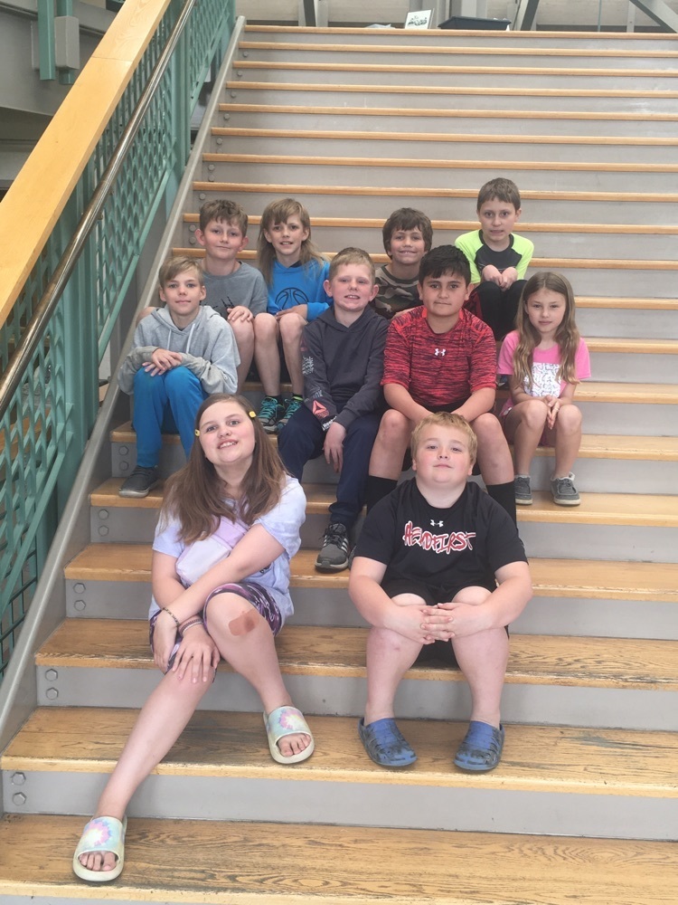 class picture on the steps of the Archeodome